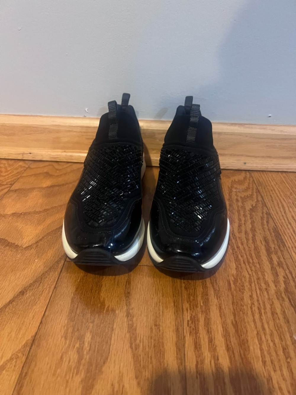 Salvatore Ferragamo Black Slip-On Athletic Sneakers with a rhinestone detailing